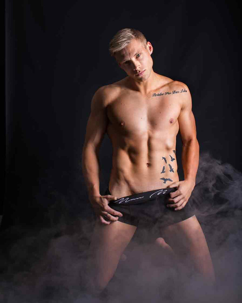 Sculpted Elegance: Male Fitness Model in Mist - Core Benefits Toowoomba