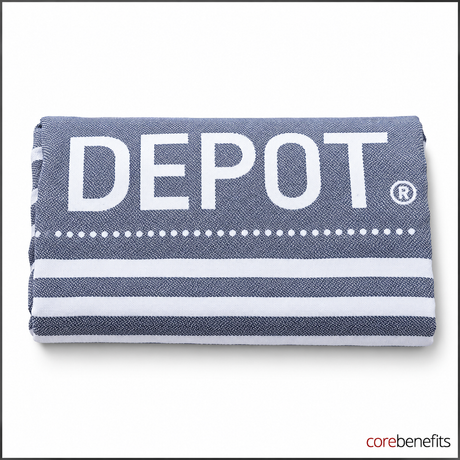 DEPOT grey and white cotton beach towel folded on a white background