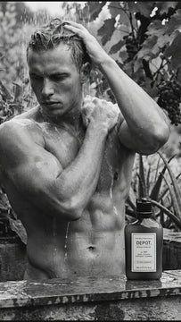Man showering outdoors and washing hair with DEPOT® No. 109 Anti-Itch Soothing Shampoo for men’s scalp care