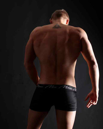 Silhouette of Strength: Back View of a Male Model - Core Benefits Toowoomba